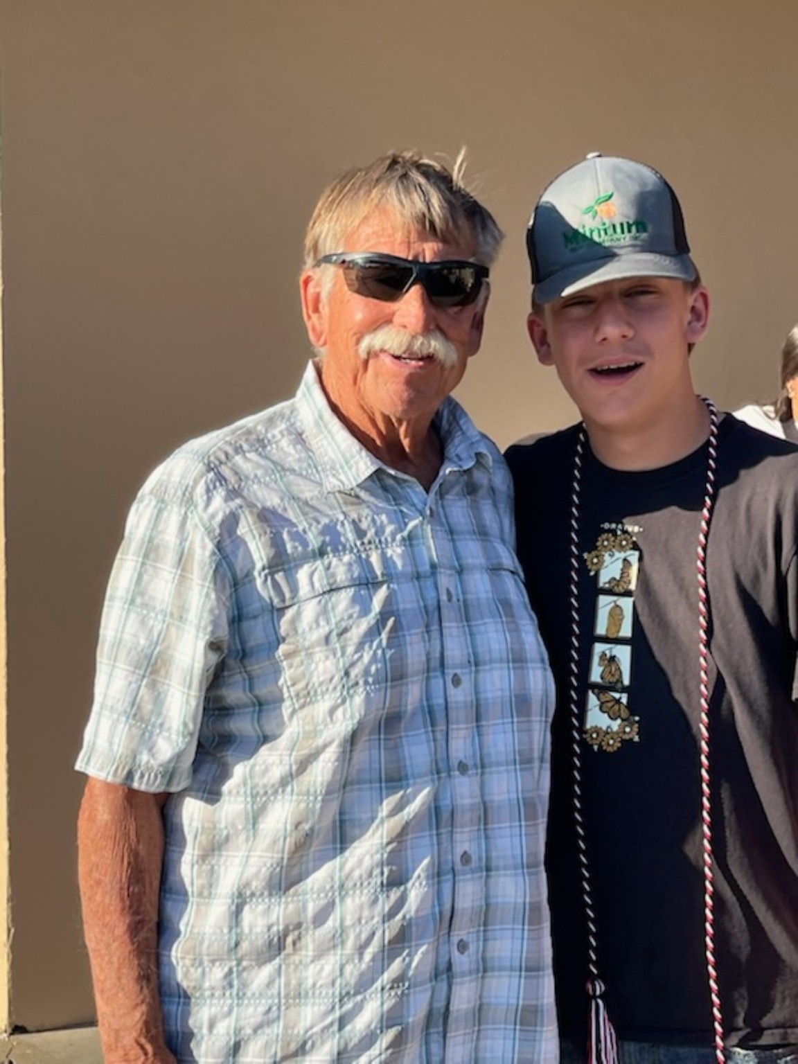 Two family members from different generations standing together
